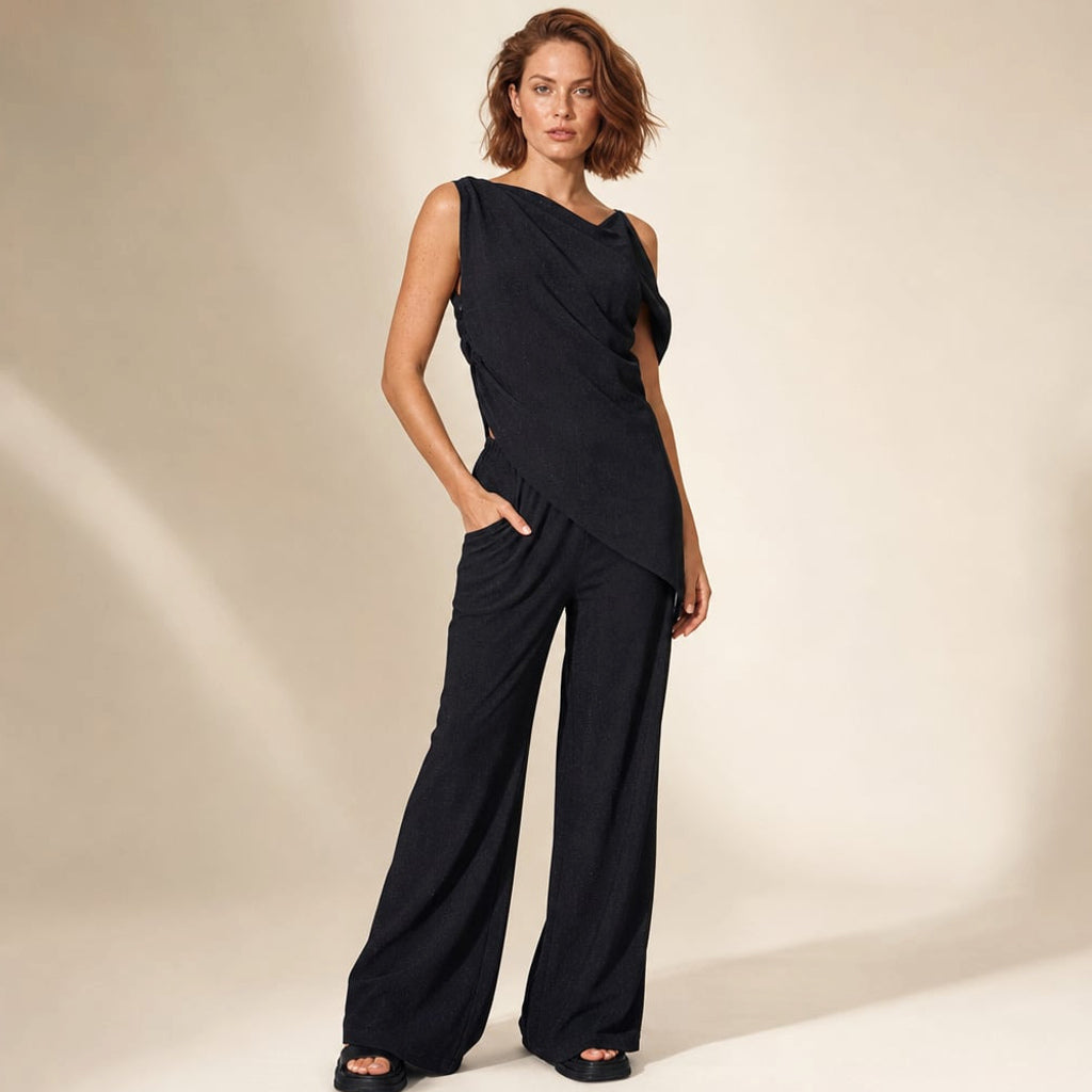 Co-ord off-shoulder asimétrico con pantalón wide-leg de algodón negro, vista frontal completa